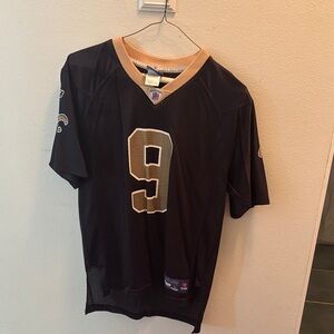 Drew Brees Jersey. Size large kids. Fits like a small for women. NEVER WORN